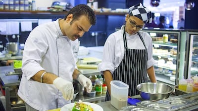 Chef Paramjeet Singh prepares a salad at the Indigo restaurant. The chain has expanded across the city as its gourmet European dishes and ambience have made it popular among well-heeled individuals in Mumbai. Subhash Sharma for The National