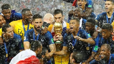 France's Hugo Lloris kisses the trophy as they celebrate after winning the World Cup. Reuters