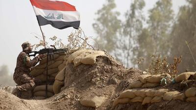 Iraqi fighters from the Shiite Al Abbas popular mobilisation unit in position near the village of Dujail north of Baghdad on May 26. AFP Photo