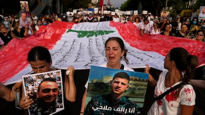 Relatives of the victims of the deadly 2020 Beirut port explosion mark the second anniversary of the blast in Beirut, Lebanon. AP