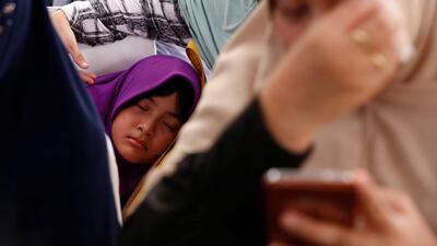 A girl who is a relative of a passenger on the crashed Lion Air flight sleeps at Bhayangkara R Said Sukanto hospital in Jakarta, Indonesia. Reuters