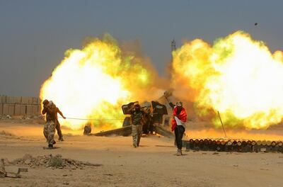 Iraqi security forces and allied Popular Mobilization forces fire artillery during fight against ISIS militants in Fallujah, Iraq. AP, File
