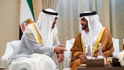 President Sheikh Mohamed speaks with Sheikh Saif bin Mohammed at the Eid event