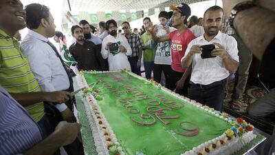 People photograph a specially made Independence Day cake.