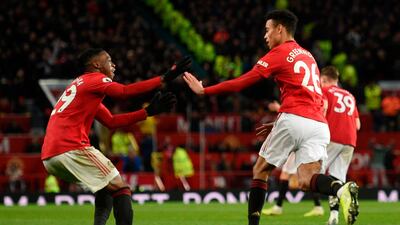 Manchester United striker Mason Greenwood (R) celebrates scoring their equaliser. AFP