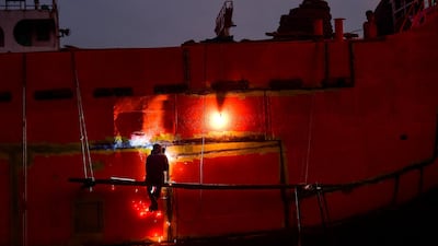 A Bangladeshi labourer works in a dockyard beside the Buriganga River in Dhaka. AFP