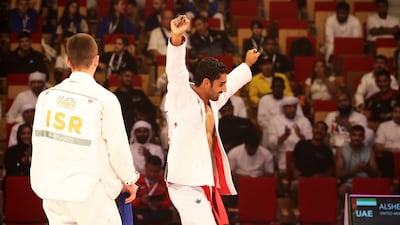 UAE's Khaled Al Shehhi from UAE (red) beat Amitmeir Burshtein from Israel (blue) in the 62 kg final. Pawan Singh / The National