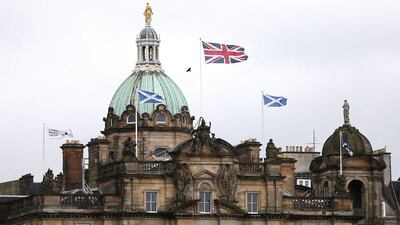 British and Scottish flags fly outside the Lloyds Banking Group’s Scottish headquarters in Edinburgh. Suzanne Plunkett / Reuters