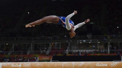 USA gymnast Simone Biles competes in the beam event of the women’s gymnastics individual all-around final at the 2016 Rio Olympics at Rio Olympic Arena on August 11, 2016 in Rio de Janeiro, Brazil. Ben Stansall / AFP
