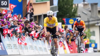 Tadej Pogacar crosses the finish line in Leysin. EPA