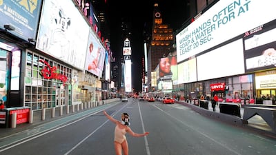 Ballet dancer and performer Ashlee Montague of New York wears a gas mask while she dances in Times Square in Manhattan, New York City. Reuters