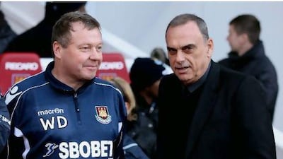 Wally Downes, left, the new assistant coach to Grant, cut an authoritative figure on the touchline during the Wigan game.