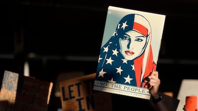 Shepard Fairey's famous image has been used to defend the status of Muslims in the United States. AP