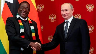 Russian President Vladimir Putin (R) shakes hands with Zimbabwean President Emmerson Mnangagwa (L) during a signing ceremony following their talks in the Kremlin in Moscow, on January 15, 2019. Zimbabwean President arrived in Moscow on a three-day official visit. / AFP / POOL / Sergei CHIRIKOV