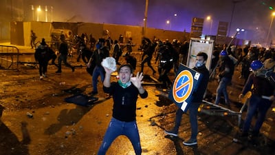 Anti-government demonstrators clash with riot police in Beirut. AP Photo