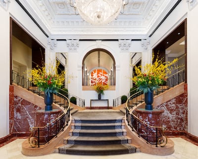 A sweeping staircase greets guests as they enter the hotel. Photo: Peninsula Hotels