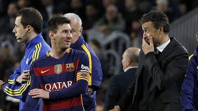Diego Forlan picked Lionel Messi, left, as his player of the year, and Luis Enrique as coach. Marta Perez / EPA