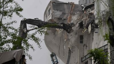 Workers demolish a seating area in the Workers' Stadium in Beijing. AFP