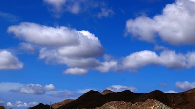 Clouds darken the mountain peaks in the Northern Emirates.