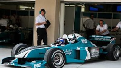 Jaime Campbell-Walter and The National's Graham Caygill in a two seater Formula One car test out the Yas Marina circuit.