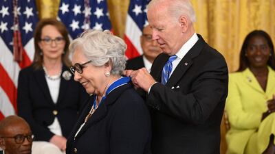 Mr Biden presents educator Dr Julieta Garcia with the Presidential Medal of Freedom. AFP