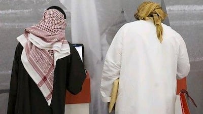 Emiratis attend the Abu Dhabi Recruitment Show at the Abu Dhabi Exhibition Center. Lauren Lancaster / The National