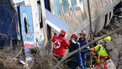 Firefighters and rescuers work at the crash scene. EPA