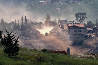 Israeli army vehicles manoeuvre on the Lebanese side of the border. EPA