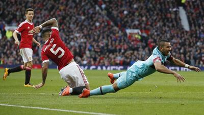 West Ham’s Dimitri Payet goes down in the area after a challenge from Manchester United’s Marcos Rojo however a penalty is not awarded. Reuters / Andrew Yates