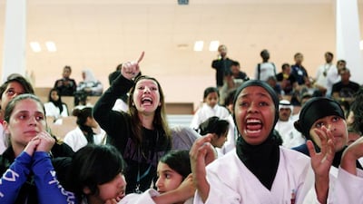 Spectators watch competitors take part in the World Jiu-Jitsu Children's Cup at Zayed Sport City in Abu Dhabi on April 16, 2014. Christopher Pike / The National
