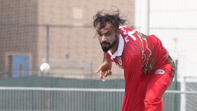 Bilal Khan bowls for Oman against the UAE during the Cricket World Cup League 2 match at the ICC Academy in Dubai.