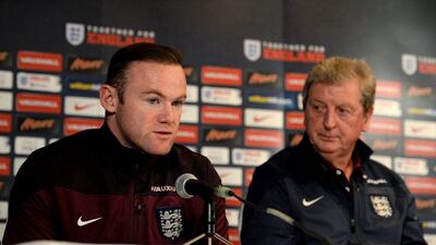 England captain Wayne Rooney, left, and manager Roy Hodgson address the media ahead of England's international friendly against France. Tony Marshall / Getty Images