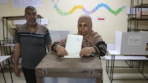 A woman votes in the municipal elections in Deir Al Balah, the first ballot of any kind in Gaza for 20 years. AFP