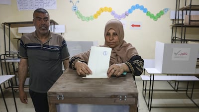 A woman votes in the municipal elections in Deir Al Balah, the first ballot of any kind in Gaza for 20 years. AFP