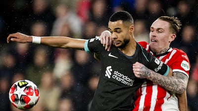 Cody Gakpo, left, of Liverpool in action against PSV's Rick Karsdorp. EPA