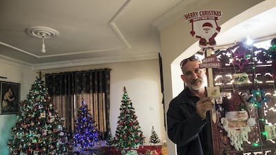 Palestinian Greek Orthodox Boulous Elias Azzam with his Christmas decorations at his home in Gaza City.