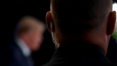 A Secret Service agent watches as President Donald Trump speaks in Bedminster, New Jersey, on August 7, 2020. AFP