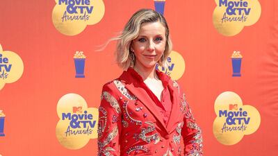 Sophia Di Martino in an embellished red suit. AFP