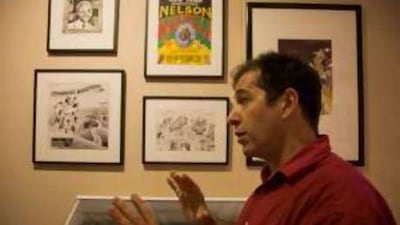 The cartoonist Jonathan Shapiro with an exhibition of his works featuring Nelson Mandela Foundation in Johannesburg.