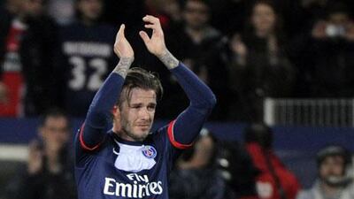 David Beckham bid farewell to football in Paris with the Beatles song 'Hello Goodbye' in the background. Fred Dufour / AFP