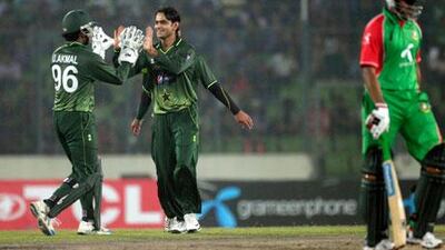 Mohammad Hafeez, centre, did well with bat and then ball against Bangladesh on Tuesday.