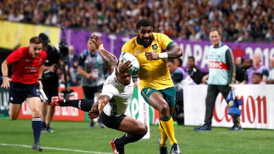 Australia's Marika Koroibete, who was born in Fiji, scores their sixth try during Saturday's 39-21 victory for the Wallabies. Reuters