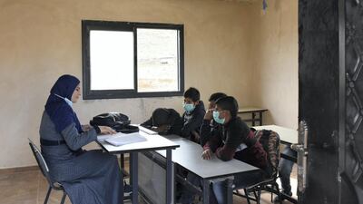The coronavirus pandemic has prompted many schools to arrange online learning, but in Ras Al Tin, north-east of Ramallah in the occupied West Bank, the pupils must learn in person as they have no electricity or computers. Rose Scammell for The National
