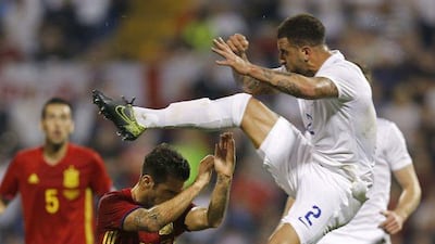 Kyle Walker, right, fights for the ball with Cesc Fabregas. Juan Carlos Cardenas / EPA