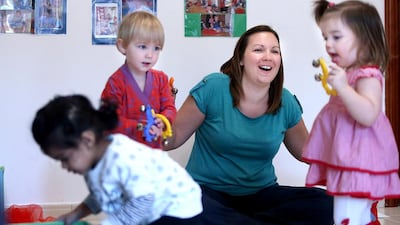 Lisa Irwin uses a variety of methods, including puppetry, light wands and tambourines, to keep the children engaged. Delores Johnson / The National