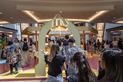 Crowds gather at Mall of the Emirates in Dubai for the launch of Fix Dessert Chocolatier's new mango flavoured bar. Antonie Robertson / The National
