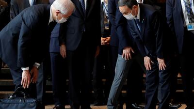 Japan's Chief Cabinet Secretary Yoshihide Suga bows as he is welcomed by officials, following the departure of outgoing Prime Minister Shinzo Abe, at the official prime minister's residence in Tokyo. REUTERS