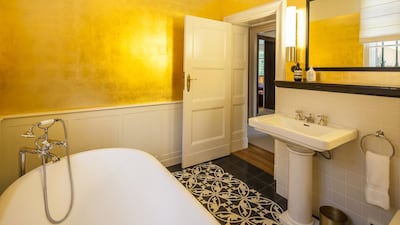 Up a grand oak staircase, four large bedrooms are arranged around a formal gallery as well as a master bathroom and study. Courtesy 16elements Architekturfotografie via Savills International