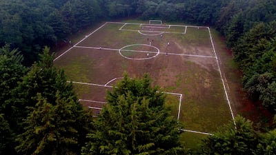 An aerial view of a football field at the Teoca volcano crater in the town of Santa Cecilia Tepetlapa, on the outskirts of Mexico City. AFP