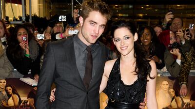 Robert Pattinson and Kristen Stewart, in Roberto Cavalli, attend the premiere of 'The Twilight Saga: Breaking Dawn - Part 1' at Westfield Stratford City on November 16, 2011 in London, England.